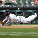 
              Detroit Tigers's Javier Baez slides home on a sacrifice fly fby Jeimer Candelario in the sixth inning of a baseball game against the Chicago White Sox, Sunday, Sept. 18, 2022, in Detroit. (AP Photo/Jose Juarez)
            