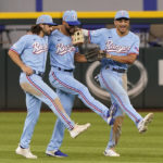 
              Texas Rangers out fielders Josh Smith, left, Leody Taveras, center, and Bubba Thompson dance together after the final out of the baseball game against the Toronto Blue Jays in Arlington, Texas, Sunday, Sept. 11, 2022. The Rangers won 4-1. (AP Photo/LM Otero)
            
