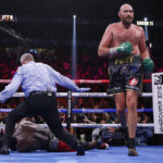 
              FILE - Tyson Fury, of England, walks away after knocking out Deontay Wilder in the 11th round of a heavyweight championship boxing match on Oct. 9, 2021, in Las Vegas. Wilder and Fury both scored knockdowns early in the third bout in October 2021, but Fury finished Wilder in the 11th. (AP Photo/Chase Stevens, File)
            