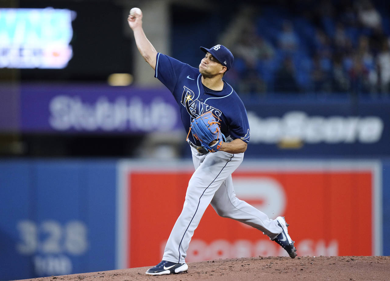 Tampa Bay Rays starting pitcher Yonny Chirinos throws to a Toronto Blue Jays batter during the firs...