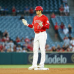 
              Los Angeles Angels' Shohei Ohtani stands at third base during the first inning of a baseball game against the Detroit Tigers in Anaheim, Calif., Monday, Sept. 5, 2022. (AP Photo/Ringo H.W. Chiu)
            