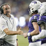 
              TCU head coach Sonny Dykes, left, congratulates quarterback Max Duggan (15) after a touchdown during the first half of an NCAA college football game against Tarleton State in Fort Worth, Texas, Saturday, Sept. 10, 2022. (AP Photo/LM Otero)
            