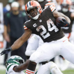 
              Cleveland Browns running back Nick Chubb (24) is stopped by New York Jets safety Jordan Whitehead during the second half of an NFL football game, Sunday, Sept. 18, 2022, in Cleveland. (AP Photo/Ron Schwane)
            