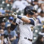 
              Milwaukee Brewers' Christian Yelich makes a single during the ninth inning of a baseball game against the New York Yankees Sunday, Sept. 18, 2022, in Milwaukee. (AP Photo/Kenny Yoo)
            