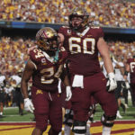 
              Minnesota running back Mohamed Ibrahim (24) celebrates with offensive lineman John Michael Schmitz (60) after Ibrahim scored a touchdown against Colorado during the first half of an NCAA college football game, Saturday, Sept. 17, 2022, in Minneapolis. (AP Photo/Stacy Bengs)
            