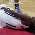 
              United States' Kahleah Copper reacts as she lies on the court injured during their quarterfinal game at the women's Basketball World Cup against Serbia in Sydney, Australia, Thursday, Sept. 29, 2022. (AP Photo/Mark Baker)
            