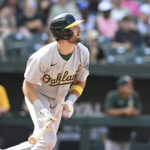 
              Oakland Athletics' Cody Thomas follows through on a single against the Baltimore Orioles in the eighth inning of a baseball game, Sunday, Sept. 4, 2022, in Baltimore. (AP Photo/Gail Burton)
            