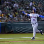 
              New York Mets' Eduardo Escobar runs the bases after hitting a grand slam against the Oakland Athletics during the fifth inning of a baseball game in Oakland, Calif., Friday, Sept. 23, 2022. (AP Photo/Godofredo A. Vásquez)
            