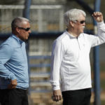 
              FILE - Kansas City Royals general manager Dayton Moore, left, and owner John Sherman watch a drill during spring training baseball practice Wednesday, Feb. 19, 2020, in Surprise, Ariz. The Kansas City Royals, Wednesday, Sept. 21, 2022, fired longtime general manager Dayton Moore. Royals owner John Sherman, who had retained Moore after acquiring the club from David Glass in 2019, announced the decision in a news conference that Moore attended at Kauffman Stadium on Wednesday. (AP Photo/Charlie Riedel, File)
            
