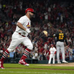 
              St. Louis Cardinals' Albert Pujols, left, rounds the bases after hitting a solo home run off Pittsburgh Pirates starting pitcher Johan Oviedo (62) during the fourth inning of a baseball game Friday, Sept. 30, 2022, in St. Louis. (AP Photo/Jeff Roberson)
            