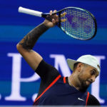 
              Nick Kyrgios, of Australia, tosses his racket as he plays Karen Khachanov, of Russia, during the quarterfinals of the U.S. Open tennis championships, Tuesday, Sept. 6, 2022, in New York. (AP Photo/Frank Franklin II)
            