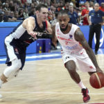
              Spain's Lorenzo Brown, right, is challenged by Terry Tarpey of France, left, during the Eurobasket final basketball match between Spain and France in Berlin, Germany, Sunday, Sept. 18, 2022. (AP Photo/Michael Sohn)
            