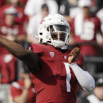 
              Washington State quarterback Cameron Ward throws a pass during the first half of an NCAA college football game against Colorado State, Saturday, Sept. 17, 2022, in Pullman, Wash. (AP Photo/Young Kwak)
            