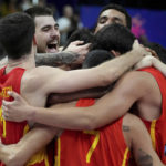 
              Spain's Juancho Hernangomez, second left, and his teammates celebrate after the Eurobasket semi final basketball match between Germany and Spain in Berlin, Germany, Friday, Sept. 16, 2022. Spain defeated Germany by 96-91. (AP Photo/Michael Sohn)
            