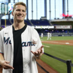 
              Florida Panthers hockey player Matthew Tkachuk tosses the ball before throwing a ceremonial pitch before Game 2 of a doubleheader baseball game between the Miami Marlins and Texas Rangers, Monday, Sept. 12, 2022, in Miami. (AP Photo/Lynne Sladky)
            