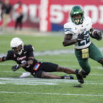 
              Tulane running back Tyjae Spears (22) breaks away from Houston defensive back Jayce Rogers (6) during the second quarter of an NCAA college football game Friday, Sept. 30, 2022, in Houston. (Brett Coomer/Houston Chronicle via AP)
            