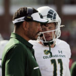 
              Colorado State head coach Jay Norvell, left, speaks with quarterback Clay Millen during the first half of an NCAA college football game against Washington State, Saturday, Sept. 17, 2022, in Pullman, Wash. (AP Photo/Young Kwak)
            