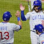 
              Chicago Cubs' Michael Hermosillo (37) celebrates with David Bote after the scored on a double by Christopher Morel during the second inning of a baseball game against the Pittsburgh Pirates on Thursday, Sept. 22, 2022, in Pittsburgh. (AP Photo/Keith Srakocic)
            
