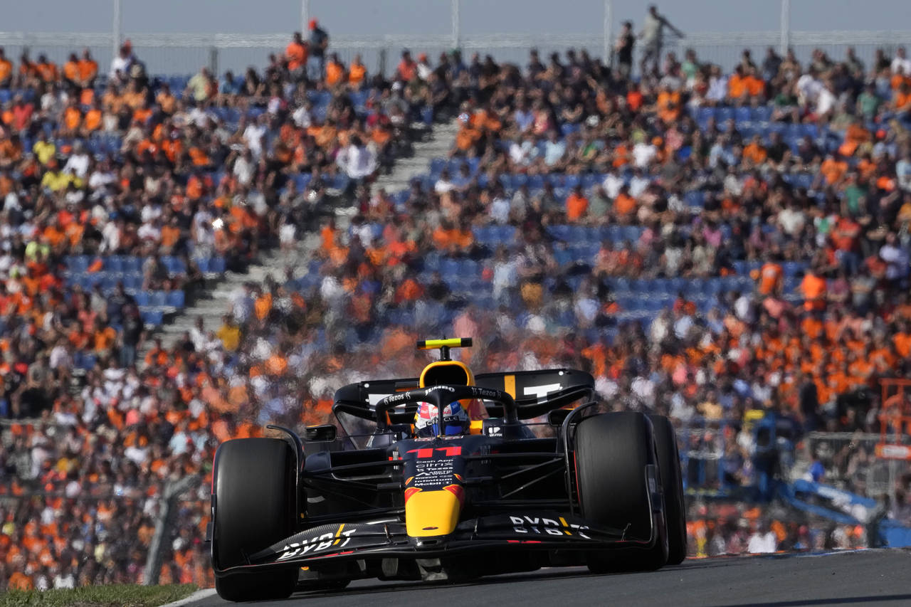 Red Bull driver Sergio Perez of Mexico steers his car during the third practice session ahead of Su...