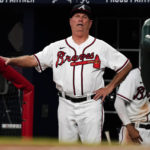 
              Atlanta Braves manager Brian Snitker watches from the dugout during a baseball game against the Colorado Rockies, Thursday, Sept. 1, 2022, in Atlanta. (AP Photo/John Bazemore)
            