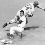 
              FILE - Los Angeles Dodgers' Maury Wills is safe at third as St. Louis Cardinals' Ken Boyer takes the throw during the first inning of a baseball game in Los Angeles, Sept. 26, 1965. Maury Wills, who helped the Los Angeles Dodgers win three World Series titles with his base-stealing prowess, has died. The team says Wills died Monday night, Sept. 19, 2022, in Sedona, Ariz. He was 89.  (AP Photo/FW)
            