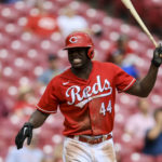 
              Cincinnati Reds' Aristides Aquino throws his bat as he reacts to hitting a fly ball for an out during the fourth inning of a baseball game against the Pittsburgh Pirates in Cincinnati, Wednesday, Sept. 14, 2022. (AP Photo/Aaron Doster)
            