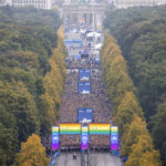 
              Runners of the first wave line up on the street of June 17 for the start of the Berlin Marathon, in Berlin, Sunday, Sept. 25, 2022. (Andreas Gora/dpa via AP)
            