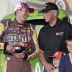 
              FILE - Kyle Busch, left, jokes with team owner Joe Gibbs, right, in victory lane after winning the pole position for Sunday's NASCAR Sprint Cup Series Coca-Cola 600 auto race at Lowe's Motor Speedway in Concord, N.C., Thursday, May 22, 2008. At bottom right are Ty Gibbs, left, and Colin Alpera, right. Kyle Busch will move to Richard Childress Racing next season, ending a 15-year career with Joe Gibbs Racing because the team could not come to terms with NASCAR's only active multiple Cup champion. Busch will drive the No. 3 Chevrolet for Childress in an announcement made Tuesday, Sept. 13, 2022, at the NASCAR Hall of Fame. (AP Photo/Terry Renna, File)
            
