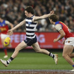 
              Max Holmes of Geelong during the AFL Preliminary Final match between the Geelong Cats and the Brisbane Lions at the Melbourne Cricket Ground in Melbourne, Friday, Sept. 16, 2022. Early Saturday morning, at a half past midnight, a small but passionate group of fans will gather in front of their TVs in America. They'll be watching the Grand Final, the Super Bowl of Aussie rules football. (AAP Image/Joel Carrett)
            
