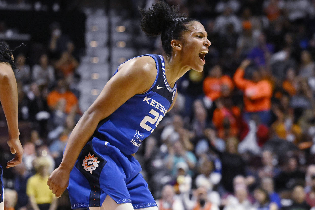 Connecticut Sun's Alyssa Thomas reacts during the first half in Game 3 of a WNBA basketball final p...