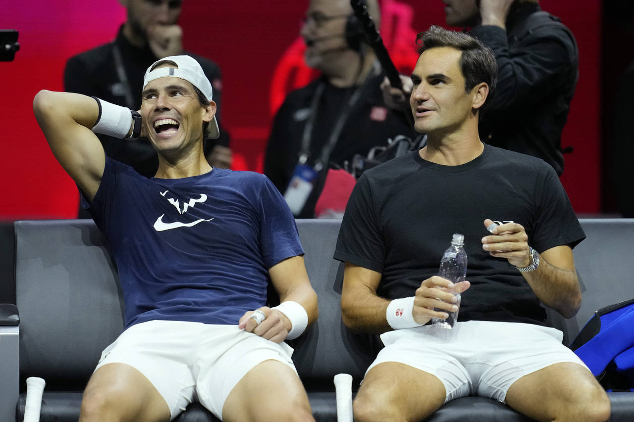 Switzerland's Roger Federer, right, and Spain's Rafael Nadal attend a training session ahead of the...