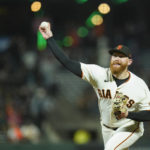 
              San Francisco Giants' Zack Littell pitches against the Atlanta Braves during the eighth inning of a baseball game in San Francisco, Monday, Sept. 12, 2022. (AP Photo/Godofredo A. Vásquez)
            