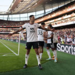 
              Fulham's Aleksandar Mitrovic, centre, celebrates after scoring his side's opening goal during the English Premier League soccer match between Arsenal and Fulham at the Emirates Stadium, London, England, Saturday, Aug. 27, 2022. (AP Photo/Alberto Pezzali)
            