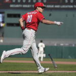 
              Philadelphia Phillies' J.T. Realmuto gestures toward teammates after hitting a three-run home run against the San Francisco Giants during the eighth inning of a baseball game in San Francisco, Sunday, Sept. 4, 2022. (AP Photo/Jeff Chiu)
            