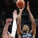
              Greece's Giannis Antetokounmpo, right, in action during the Eurobasket group C basketball match between Croatia and Greece at the Assago Forum, near Milan, Italy, Friday Sept. 2, 2022. (AP Photo/Luca Bruno)
            