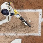 
              Milwaukee Brewers' Tyrone Taylor hits an RBI single during the seventh inning of a baseball game against the New York Mets Wednesday, Sept. 21, 2022, in Milwaukee. (AP Photo/Morry Gash)
            