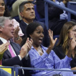 
              Michelle Obama, second from right, reacts during the semifinal match between Frances Tiafoe, of the United States, and Carlos Alcaraz, of Spain, at the U.S. Open tennis championships, Friday, Sept. 9, 2022, in New York. (AP Photo/John Minchillo)
            