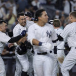 
              New York Yankees' Giancarlo Stanton celebrates with teammates, including Jose Trevino (39) and Anthony Rizzo (48), after hitting a grand slam against the Pittsburgh Pirates during the ninth inning of a baseball game Tuesday, Sept. 20, 2022, in New York. (AP Photo/Jessie Alcheh)
            