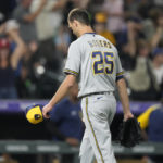 
              Milwaukee Brewers relief pitcher Taylor Rogers heads to the dugout after giving up a three-run home run to Colorado Rockies' Randal Grichuk during the 10th inning of a baseball game Tuesday, Sept. 6, 2022, in Denver. (AP Photo/David Zalubowski)
            