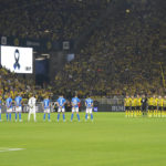 
              Team players and referees, right, stand during a minute of silence for the victims of the terrorist attack at the Olympic Games in Munich in 1972, prior the German Bundesliga soccer match between Borussia Dortmund and TSG 1899 Hoffenheim in Dortmund, Germany, Friday, Sept. 2, 2022. Eleven athletes from Israel and one German police officer were killed 50 years ago in the terrorist attack during the 1972 Olympic Games in Munich. (AP Photo/Martin Meissner)
            