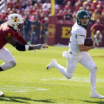 
              Baylor quarterback Blake Shapen, right, runs from Iowa State linebacker O'Rien Vance (34) and defensive end Will McDonald IV (9) during the first half of an NCAA college football game, Saturday, Sept. 24, 2022, in Ames, Iowa. (AP Photo/Charlie Neibergall)
            