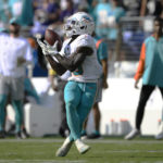 
              Miami Dolphins wide receiver Tyreek Hill (10) catches a pass for a touchdown during the second half of an NFL football game Baltimore Ravens, Sunday, Sept. 18, 2022, in Baltimore. (AP Photo/Nick Wass)
            