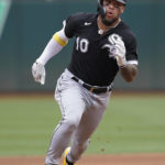 
              Chicago White Sox's Yoan Moncada advances to third base on a Jose Abreu single during the fourth inning of a baseball game against the Oakland Athletics in Oakland, Calif., Saturday, Sept. 10, 2022. (AP Photo/Jeff Chiu)
            