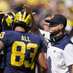 
              Michigan head coach Jim Harbaugh congratulates his players after a touchdown during the second half of an NCAA college football game against Colorado State, Saturday, Sept. 3, 2022, in Ann Arbor, Mich. (AP Photo/Carlos Osorio)
            