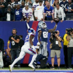 
              Dallas Cowboys wide receiver CeeDee Lamb (88) makes a catch in the end zone for a touchdown against New York Giants cornerback Adoree' Jackson (22) during the fourth quarter of an NFL football game, Monday, Sept. 26, 2022, in East Rutherford, N.J. (AP Photo/Frank Franklin II)
            
