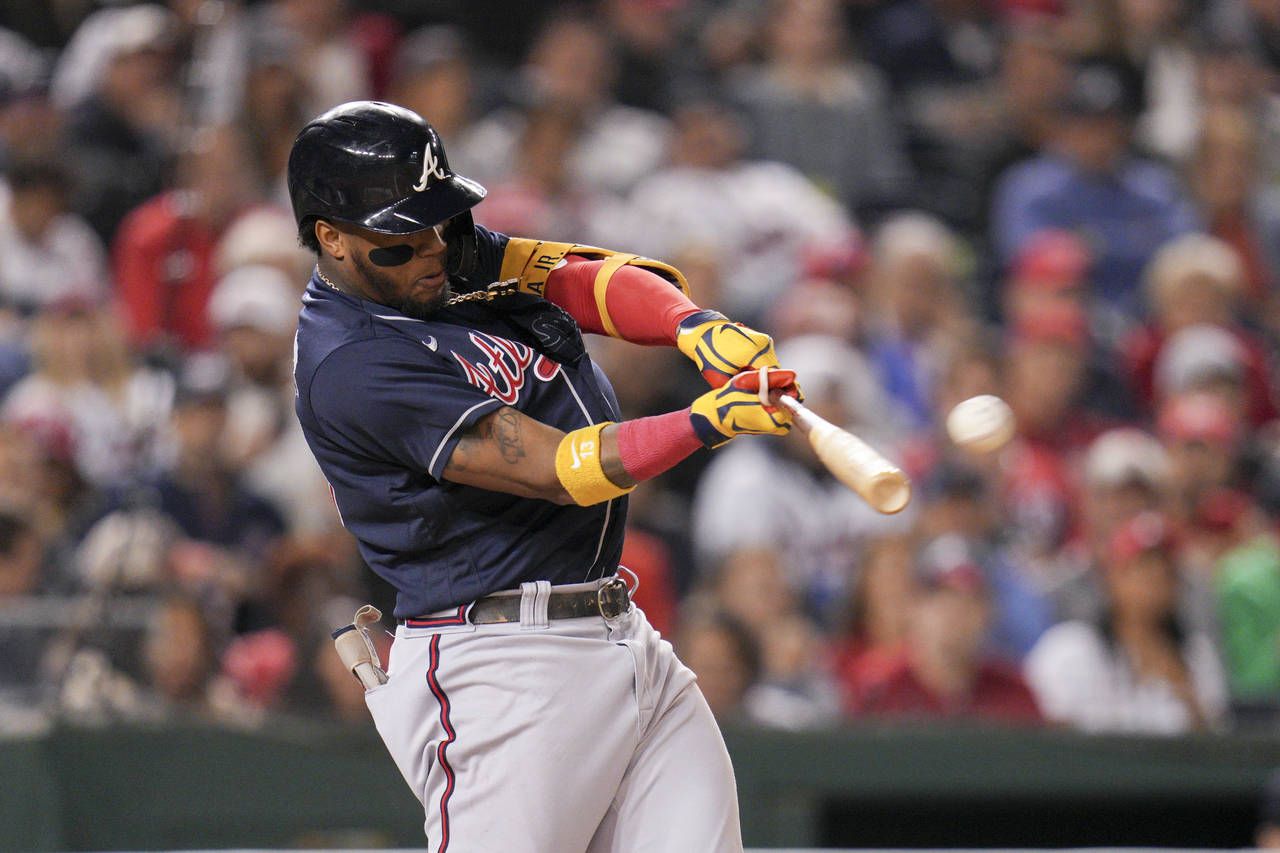 Atlanta Braves' Ronald Acuna Jr. hits a solo home run against the Washington Nationals during the f...