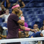 
              Rafael Nadal, of Spain, holds his nose after it was struck by his racket, during a medical timeout during a match against Fabio Fognini, of Italy, during the second round of the U.S. Open tennis championships, early Friday, Sept. 2, 2022, in New York. (AP Photo/Frank Franklin II)
            