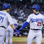 
              Los Angeles Dodgers' Trayce Thompson (25) celebrates his home run against the Arizona Diamondbacks with Miguel Vargas (71) during the fourth inning of a baseball game in Phoenix, Wednesday, Sept. 14, 2022. (AP Photo/Ross D. Franklin)
            