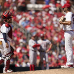 
              St. Louis Cardinals catcher Yadier Molina, left, walks out to talk to starting pitcher Adam Wainwright during the fifth inning of a baseball game against the Washington Nationals Thursday, Sept. 8, 2022, in St. Louis. (AP Photo/Jeff Roberson)
            