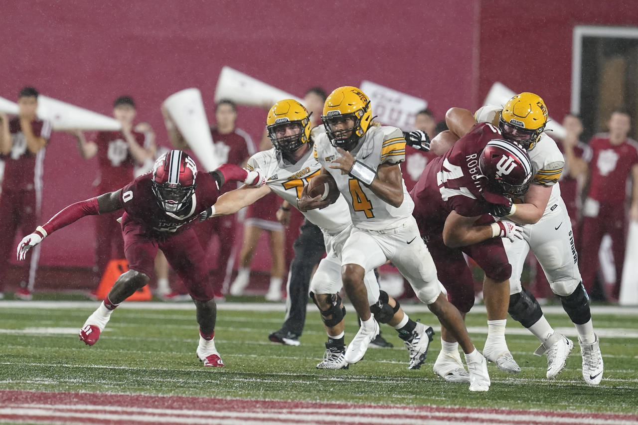 Idaho quarterback Gevani McCoy (4) runs during the first half of the team's NCAA college football g...